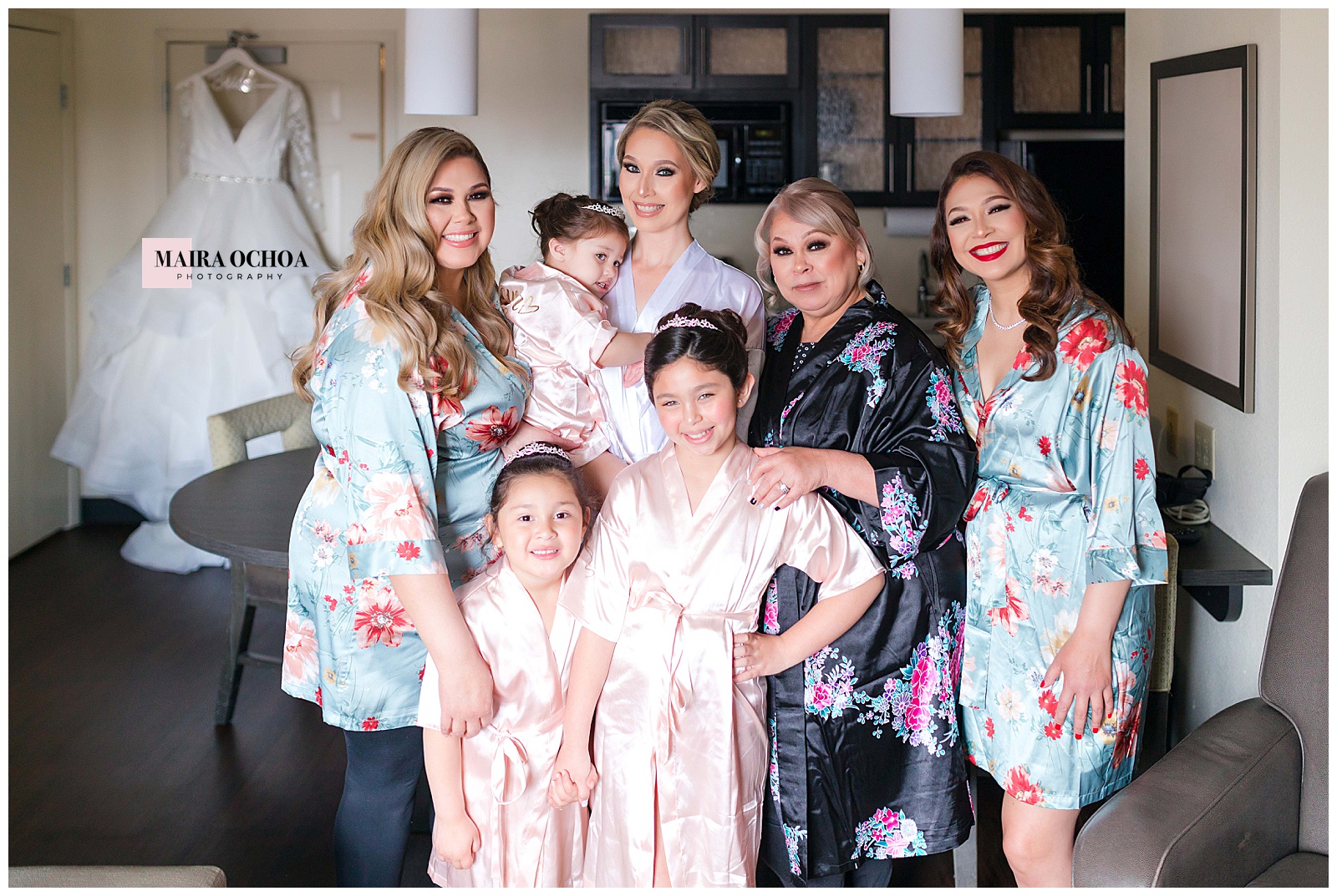 Bride getting ready makeup Sonesta Simply Suites Chicago Waukegan, Bridal Party Bed photo with cute wedding robes, flower bridesmaids robes