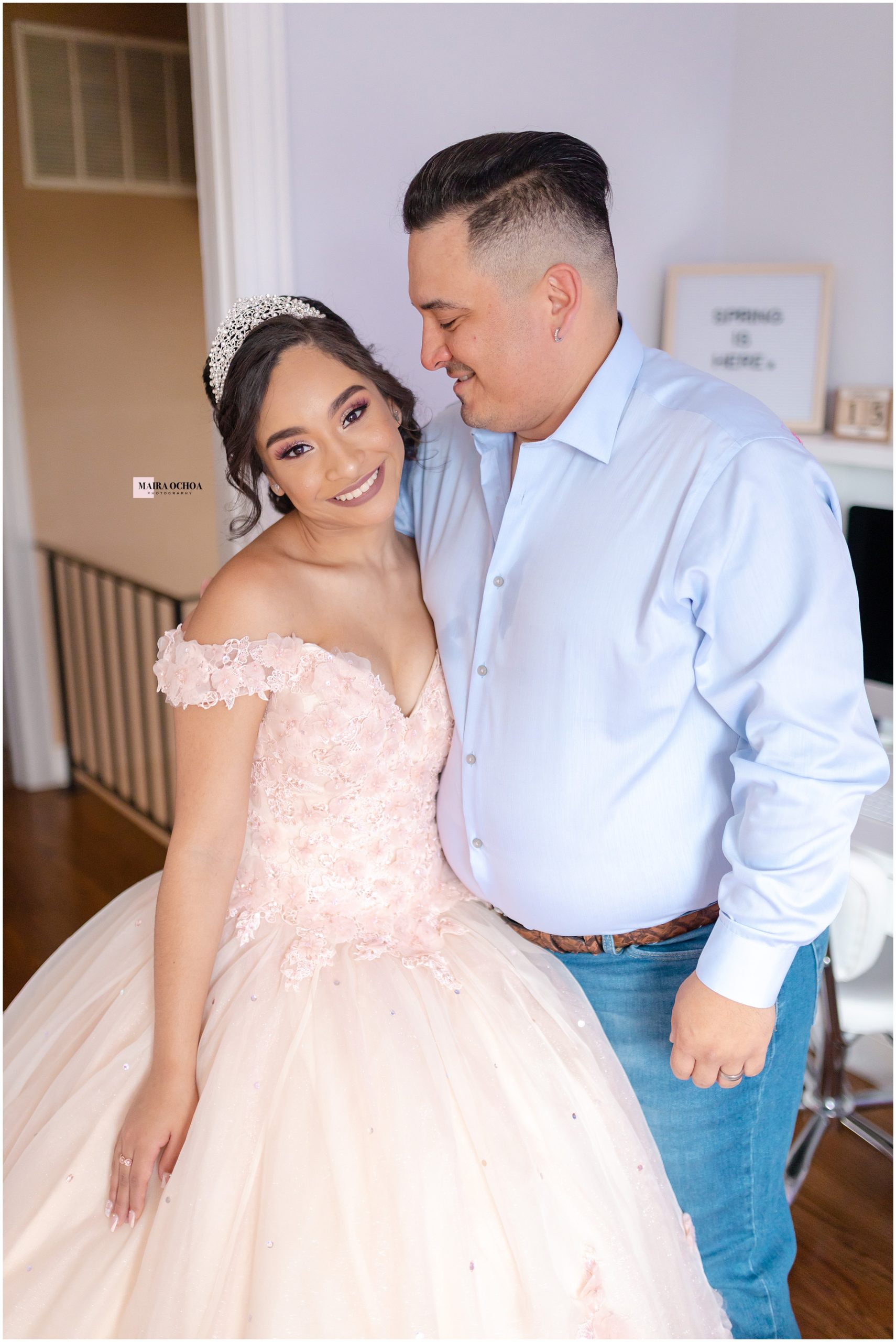 Quinceanera and dad at home in room