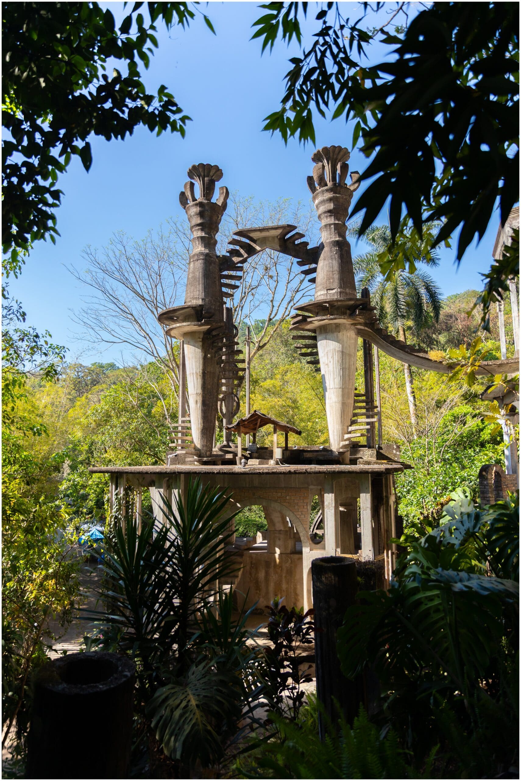 Towering concrete arches swallowed by jungle at Las Pozas, Edward James garden